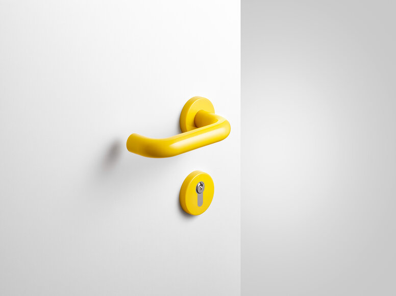 Béquille de porte HEWI jaune moutarde Béquille de porte avec rosace de clé en polyamide de couleur jaune moutarde