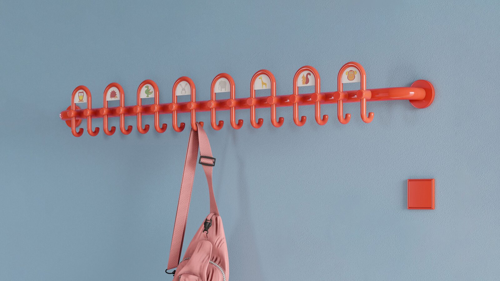 Colourful kindergarten equipped with fittings and wardrobe in the colour orange