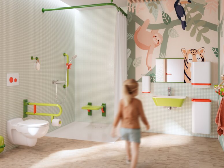 Colorful and child-friendly bathroom equipped with sanitary accessories in shades of green, white and coral