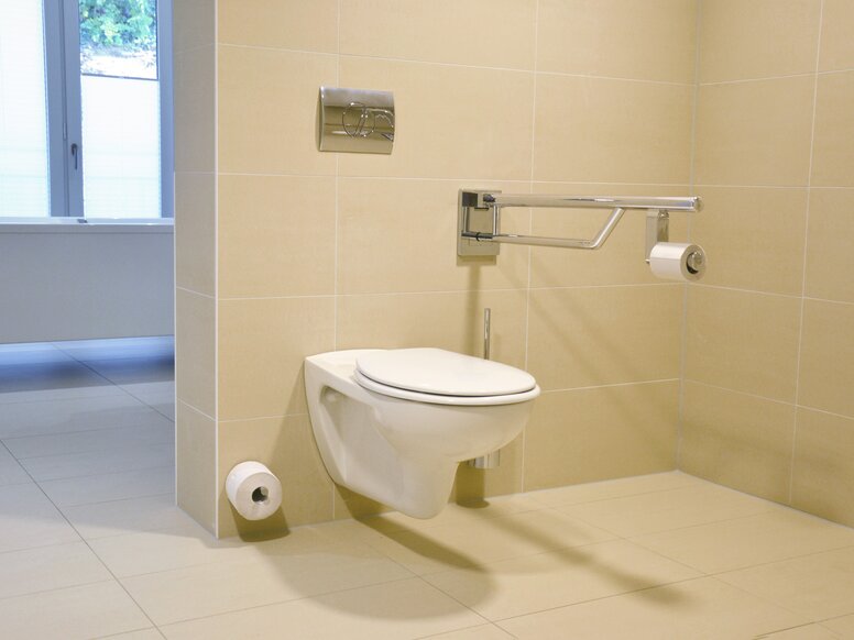 Toilet equipped with folding support handle, spare paper holder and toilet brush set