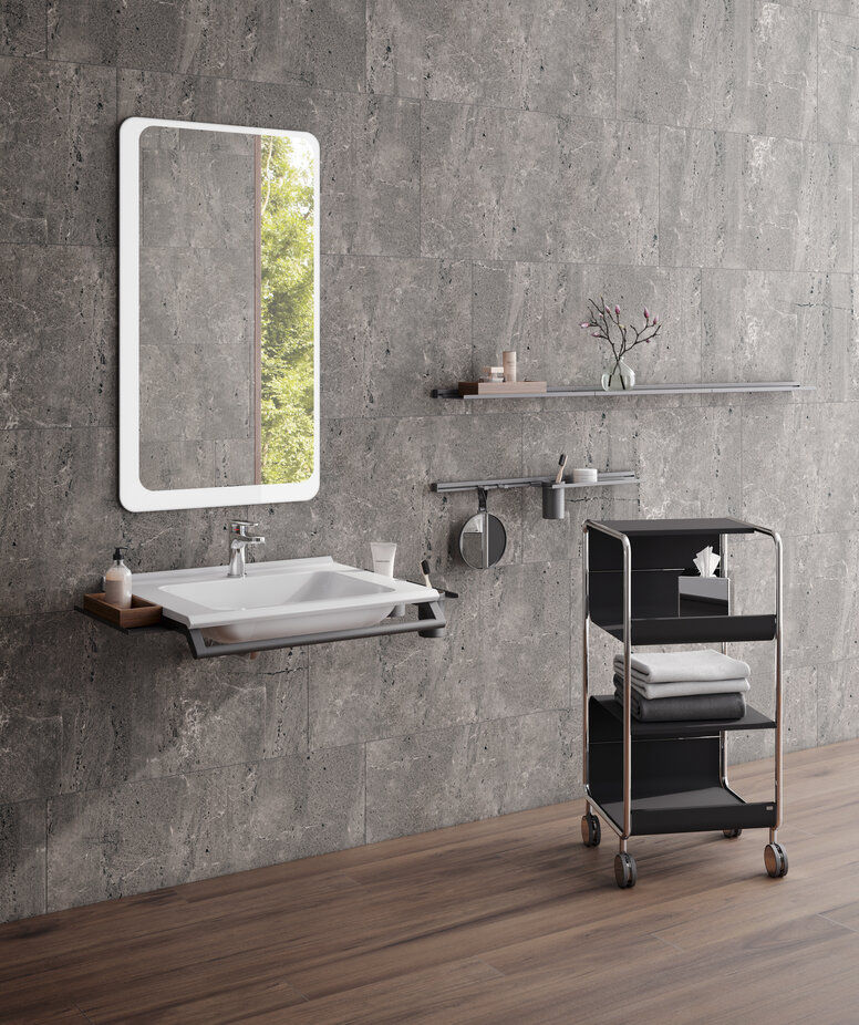 HEWI washbasin and side trolley Modular washbasin with grab rail and shelves, side trolley next to it in matt black